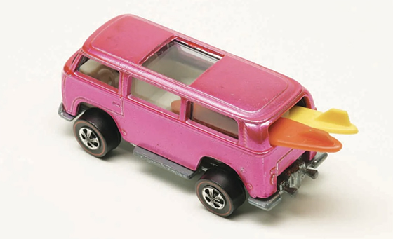 A rare collecticle pink Hotwheels van with surfboards